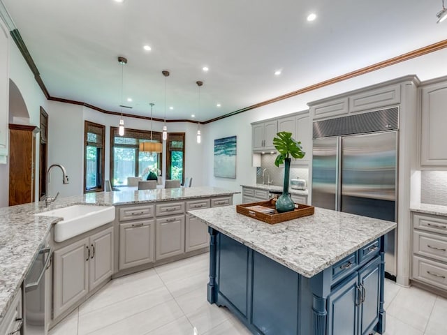 6302 Waggoner Dr, Dallas, TX 75230 - kitchen featuring a sink, stainless steel appliances, a center island, light tile patterned flooring, and gray cabinetry