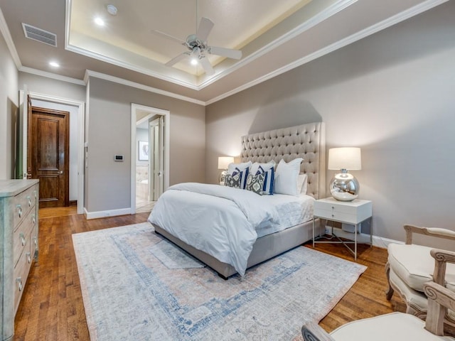 6302 Waggoner Dr, Dallas, TX 75230 - bedroom with a raised ceiling, wood finished floors, crown molding, baseboards, and ensuite bath