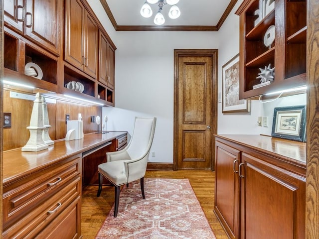 6302 Waggoner Dr, Dallas, TX 75230 - home office with built in study area, crown molding, dark wood-style flooring, and baseboards
