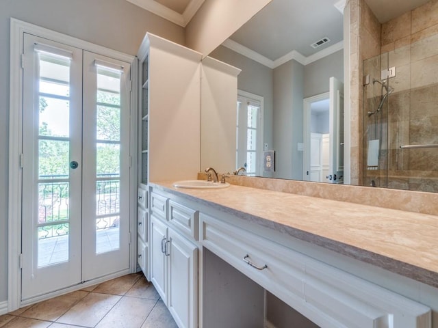 6302 Waggoner Dr, Dallas, TX 75230 - full bathroom featuring french doors, a stall shower, ornamental molding, vanity, and tile patterned flooring