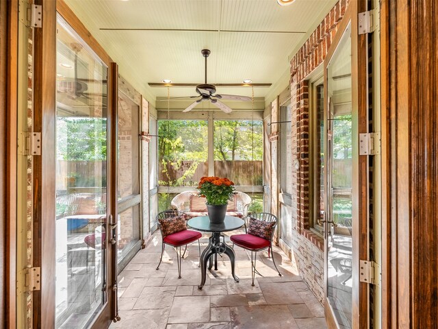 6302 Waggoner Dr, Dallas, TX 75230 - sunroom / solarium with ceiling fan, stone tile flooring, and healthy amount of natural light