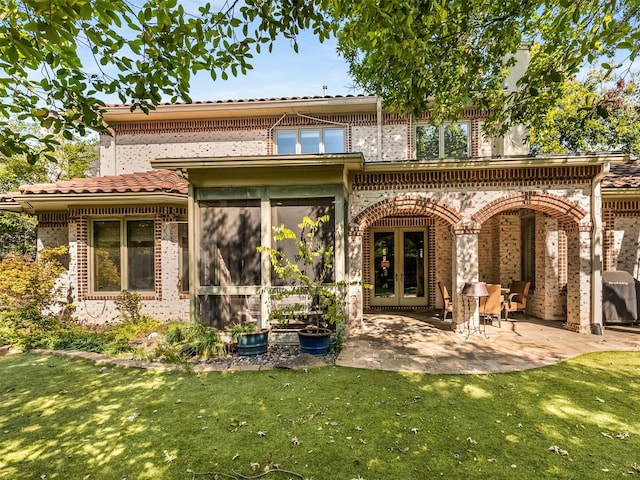 6302 Waggoner Dr, Dallas, TX 75230 - rear view of house with brick siding, a yard, a patio, and french doors