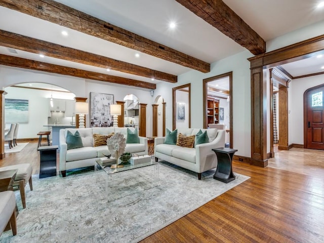 6302 Waggoner Dr, Dallas, TX 75230 - living room with wood finished floors, arched walkways, baseboards, recessed lighting, and beamed ceiling