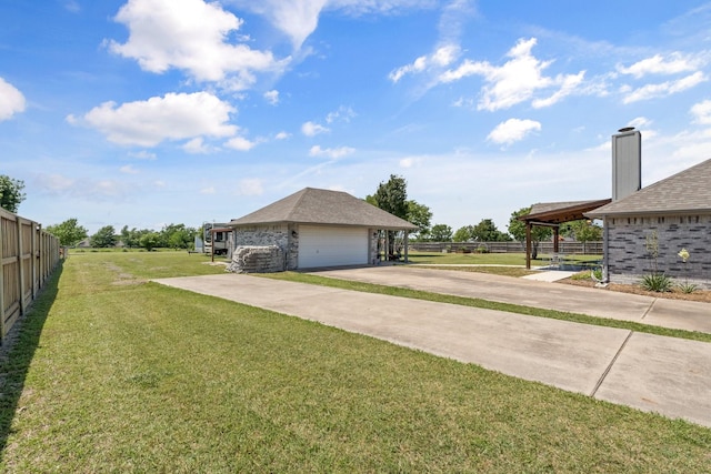 1930 Copper Ridge Cir, Rockwall, TX 75032 - view of yard with a detached garage and concrete driveway