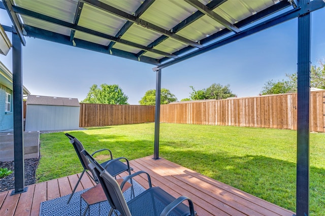 wooden deck featuring an outbuilding and a shed