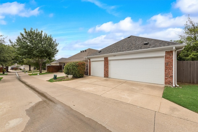 8621 Nichols Way N, Richland Hills, TX 76180 - view of front facade with brick siding, concrete driveway, fence, and a shingled roof