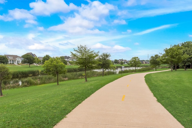 8621 Nichols Way N, Richland Hills, TX 76180 - view of home's community featuring a lawn, a water view, and a residential view