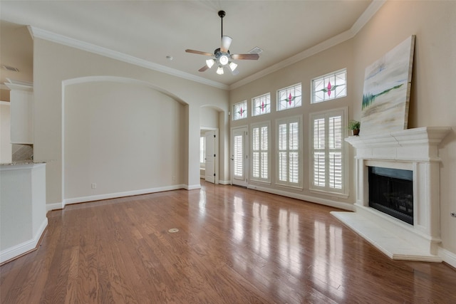 8621 Nichols Way N, Richland Hills, TX 76180 - unfurnished living room with a ceiling fan, a fireplace with raised hearth, crown molding, wood finished floors, and baseboards