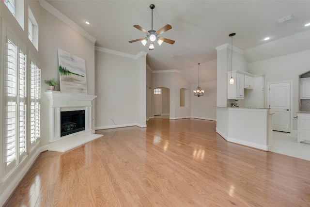 8621 Nichols Way N, Richland Hills, TX 76180 - unfurnished living room with plenty of natural light, a ceiling fan, lofted ceiling, light wood finished floors, and a fireplace with raised hearth