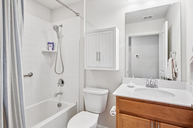 bathroom featuring toilet, shower / bath combo, and vanity