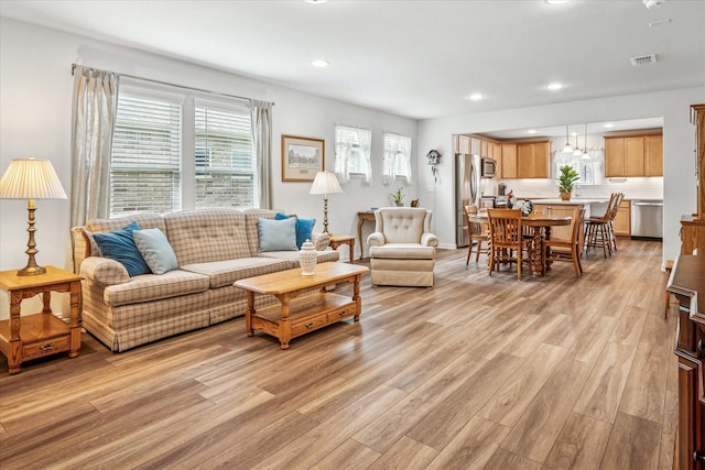 9109 Water Willow Way, Mckinney, TX 75071 - living room with light wood finished floors and recessed lighting