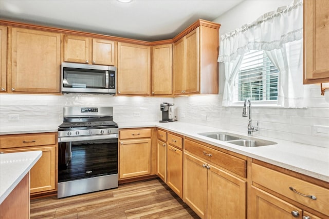 9109 Water Willow Way, Mckinney, TX 75071 - kitchen with appliances with stainless steel finishes, light countertops, light wood-type flooring, and tasteful backsplash