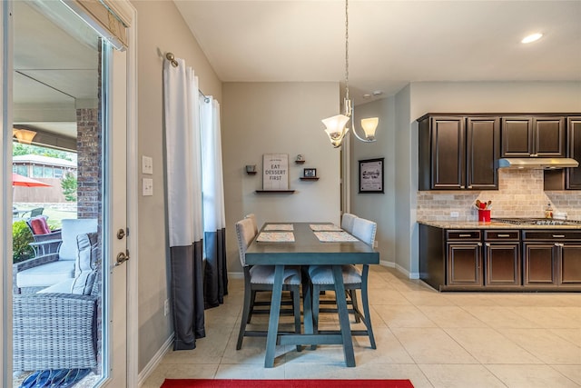 dining room with light tile patterned floors, baseboards, a chandelier, and recessed lighting