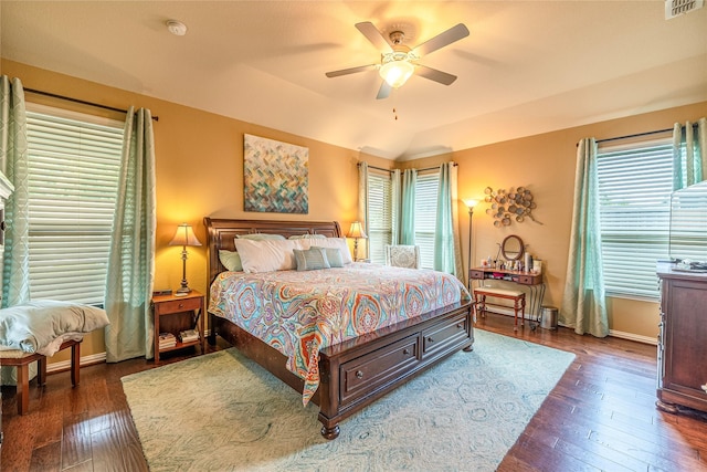 bedroom with wood-type flooring, baseboards, and ceiling fan