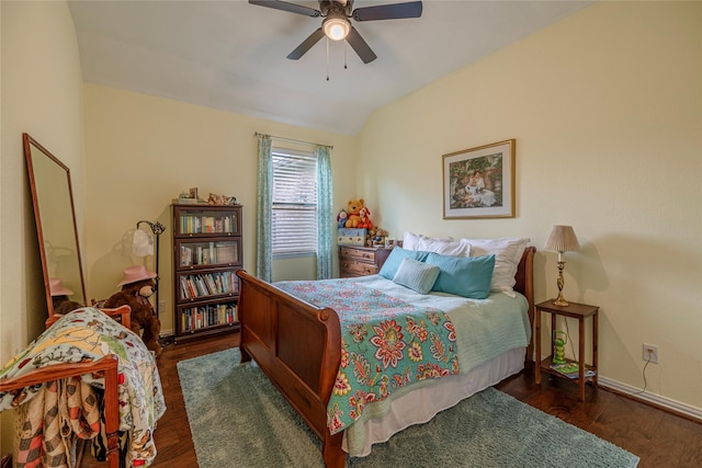 bedroom featuring vaulted ceiling, wood finished floors, baseboards, and a ceiling fan