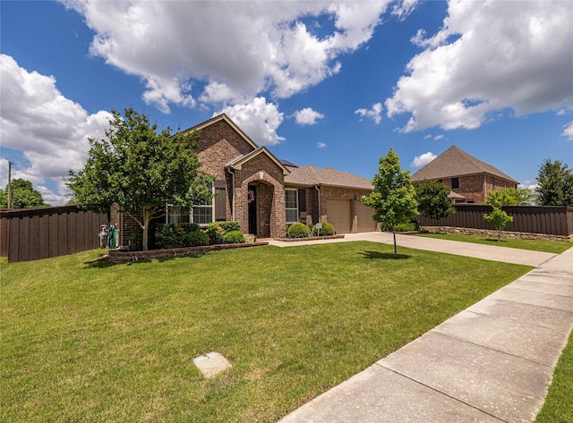 view of front facade with brick siding, driveway, and a garage