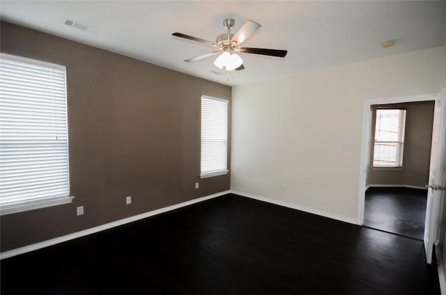 708 Flora Vista Ct, Arlington, TX 76002 - spare room with dark wood finished floors, ceiling fan, and baseboards