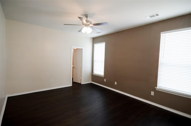 708 Flora Vista Ct, Arlington, TX 76002 - empty room with dark wood finished floors, a ceiling fan, and baseboards
