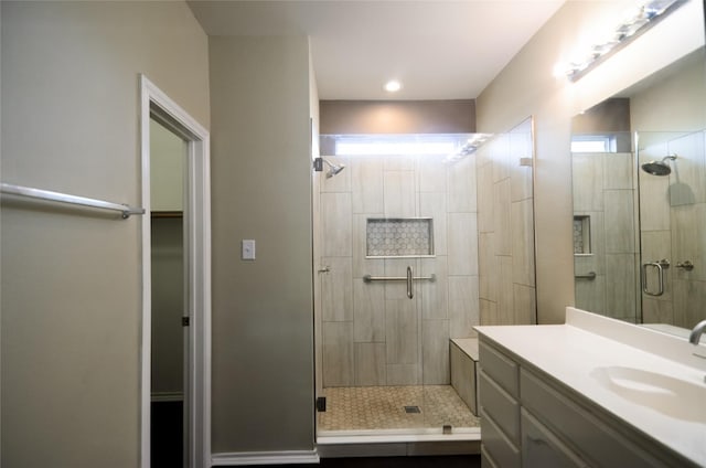 708 Flora Vista Ct, Arlington, TX 76002 - bathroom with a shower stall, vanity, and a spacious closet