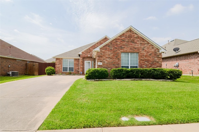 708 Flora Vista Ct, Arlington, TX 76002 - traditional-style house featuring brick siding, driveway, and central AC