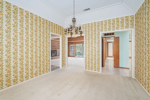 unfurnished dining area with a chandelier, wallpapered walls, carpet floors, baseboards, and a textured ceiling