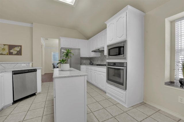 1424 Greenwich Dr, Allen, TX 75013 - kitchen featuring appliances with stainless steel finishes, tasteful backsplash, under cabinet range hood, light tile patterned floors, and white cabinets