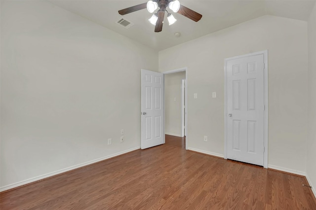 1424 Greenwich Dr, Allen, TX 75013 - unfurnished bedroom featuring wood finished floors, vaulted ceiling, a ceiling fan, and baseboards