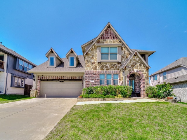1316 Brentfield Dr, Anna, TX 75409 - view of front of property with brick siding, a front lawn, concrete driveway, an attached garage, and stone siding