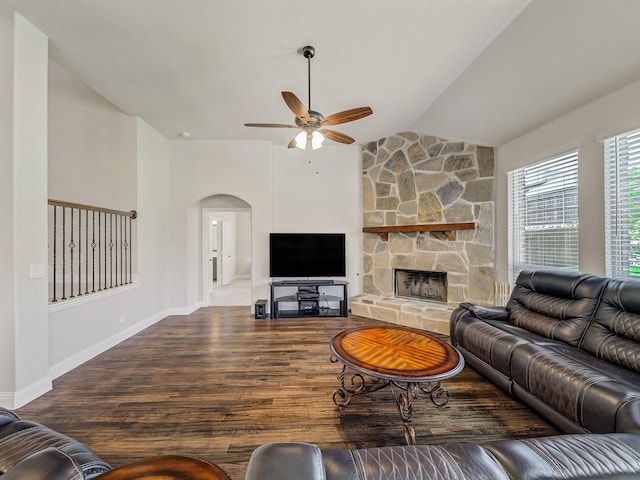 1316 Brentfield Dr, Anna, TX 75409 - living room with lofted ceiling, ceiling fan, arched walkways, a stone fireplace, and wood finished floors