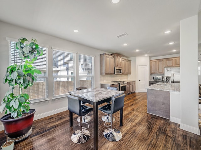1316 Brentfield Dr, Anna, TX 75409 - dining space featuring dark wood finished floors, plenty of natural light, recessed lighting, and baseboards