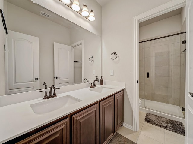 1316 Brentfield Dr, Anna, TX 75409 - bathroom with tile patterned floors, a shower stall, toilet, and double vanity