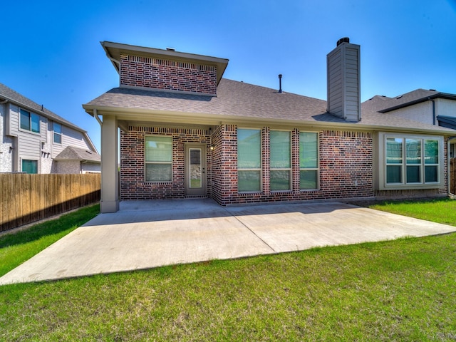 1316 Brentfield Dr, Anna, TX 75409 - back of house with brick siding, a patio, a chimney, and roof with shingles