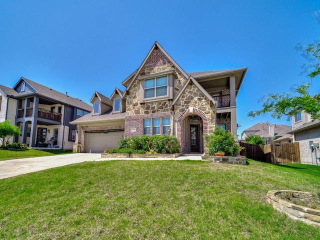 1316 Brentfield Dr, Anna, TX 75409 - english style home with stone siding, concrete driveway, brick siding, a balcony, and a garage