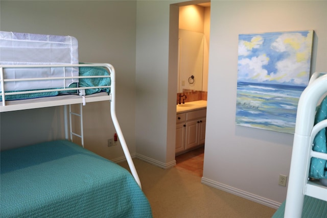11 Westview Dr, Star Harbor, TX 75148 - bedroom with light colored carpet, a sink, ensuite bathroom, and baseboards