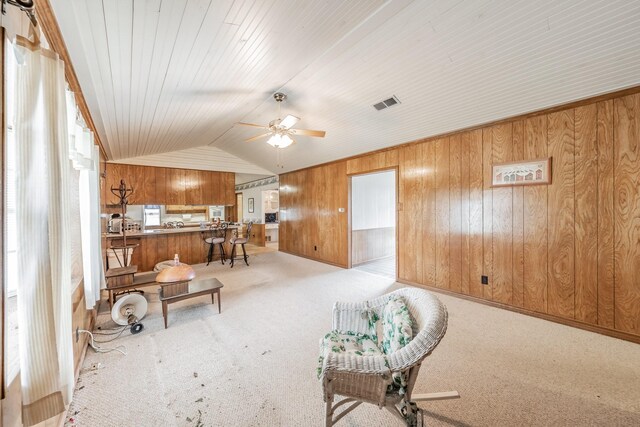 9820 County Road 514, Alvarado, TX 76009 - living area featuring carpet, a ceiling fan, wooden walls, and lofted ceiling