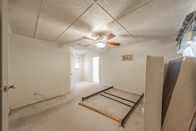 9820 County Road 514, Alvarado, TX 76009 - unfurnished bedroom with carpet, a paneled ceiling, a ceiling fan, and baseboards