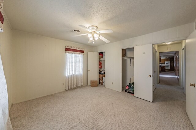 9820 County Road 514, Alvarado, TX 76009 - unfurnished bedroom with carpet flooring, a textured ceiling, and ceiling fan