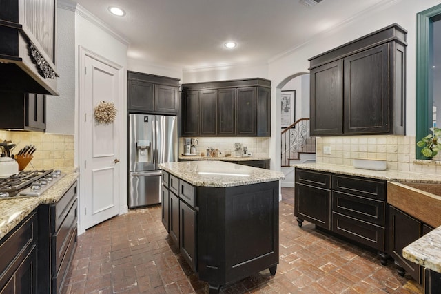 1480 Snider Ct, Lucas, TX 75002 - kitchen with appliances with stainless steel finishes, brick floors, crown molding, decorative backsplash, and recessed lighting