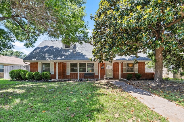 1809 Esquire Pl, Grand Prairie, TX 75050 - view of front of house featuring brick siding and roof with shingles