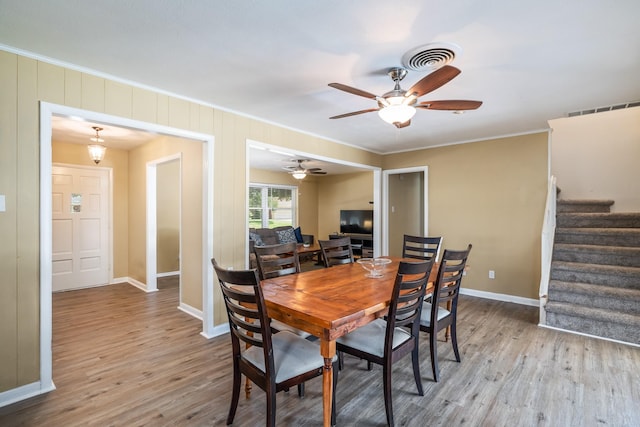 1809 Esquire Pl, Grand Prairie, TX 75050 - dining area with wood finished floors, ornamental molding, baseboards, stairs, and ceiling fan