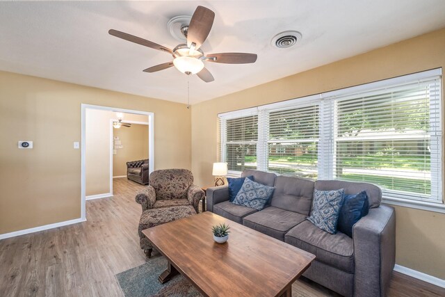 1809 Esquire Pl, Grand Prairie, TX 75050 - living room with baseboards, ceiling fan, and wood finished floors