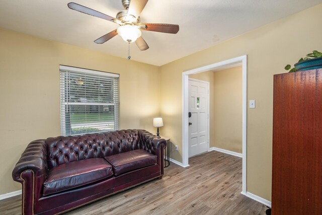 1809 Esquire Pl, Grand Prairie, TX 75050 - living area featuring wood finished floors, baseboards, and ceiling fan