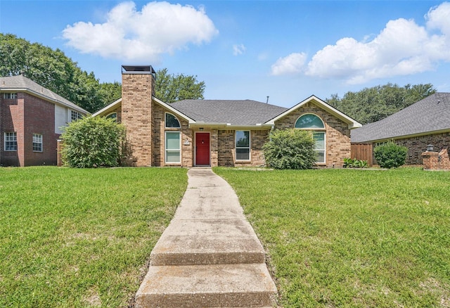 6801 Sweetwater Dr, Plano, TX 75023 - view of front of property featuring a front lawn, a chimney, brick siding, and roof with shingles