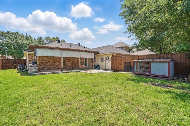 6801 Sweetwater Dr, Plano, TX 75023 - back of property with a patio area and a gate