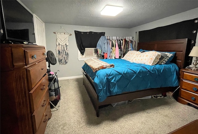 310 W Russell St, Weatherford, TX 76086 - carpeted bedroom featuring a textured ceiling, baseboards, and cooling unit