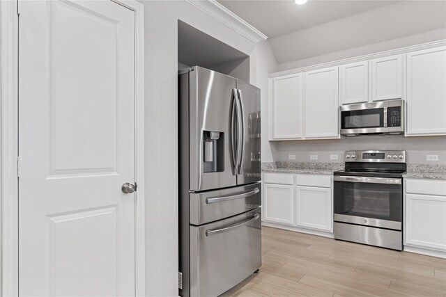 3625 Beutel Rd, Waco, TX 76655 - kitchen with stainless steel appliances, white cabinetry, light wood finished floors, and light stone countertops