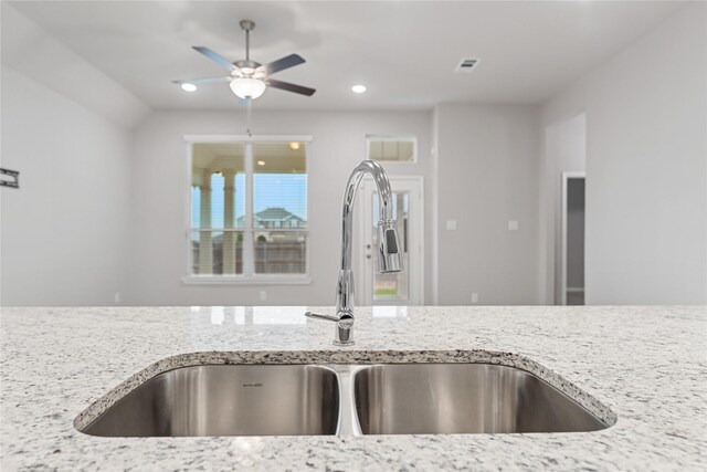 3625 Beutel Rd, Waco, TX 76655 - kitchen with a sink, light stone countertops, ceiling fan, and recessed lighting