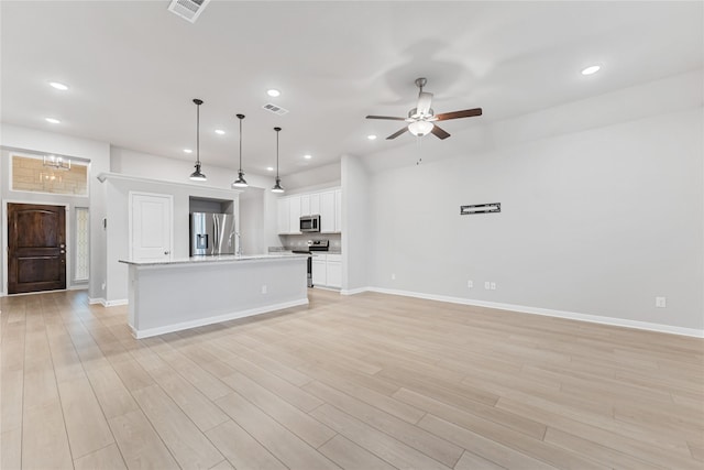 3625 Beutel Rd, Waco, TX 76655 - kitchen with appliances with stainless steel finishes, recessed lighting, light countertops, open floor plan, and baseboards