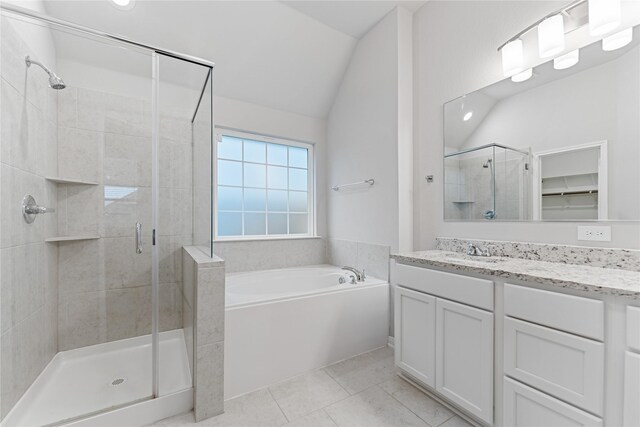 3625 Beutel Rd, Waco, TX 76655 - bathroom featuring a stall shower, a garden tub, vanity, vaulted ceiling, and tile patterned flooring
