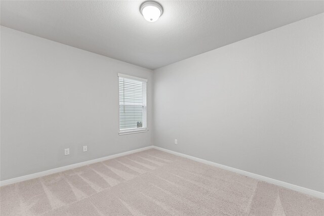 3625 Beutel Rd, Waco, TX 76655 - spare room featuring light carpet and baseboards